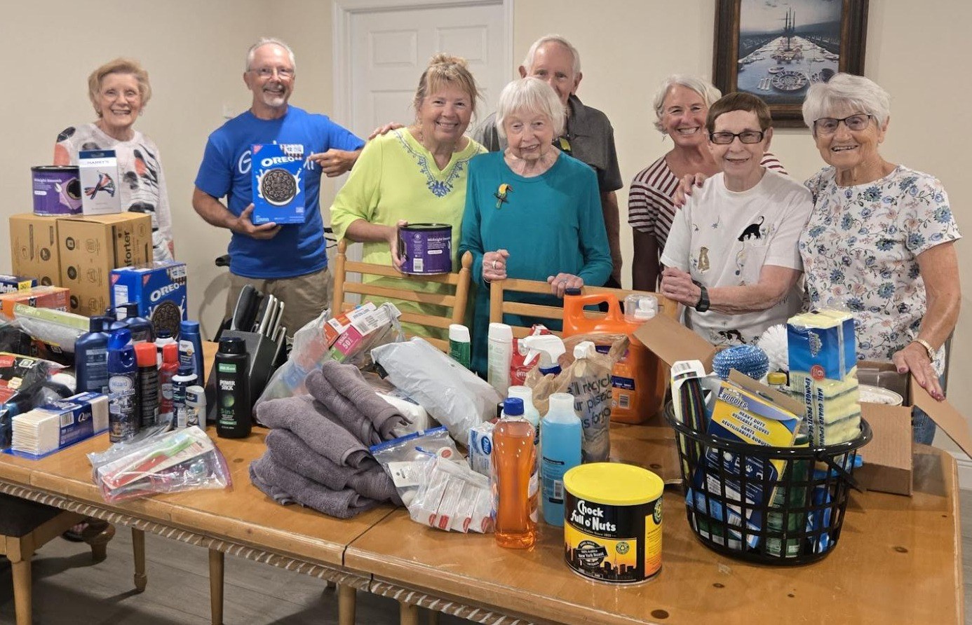 Grace Group members with donated care and household items